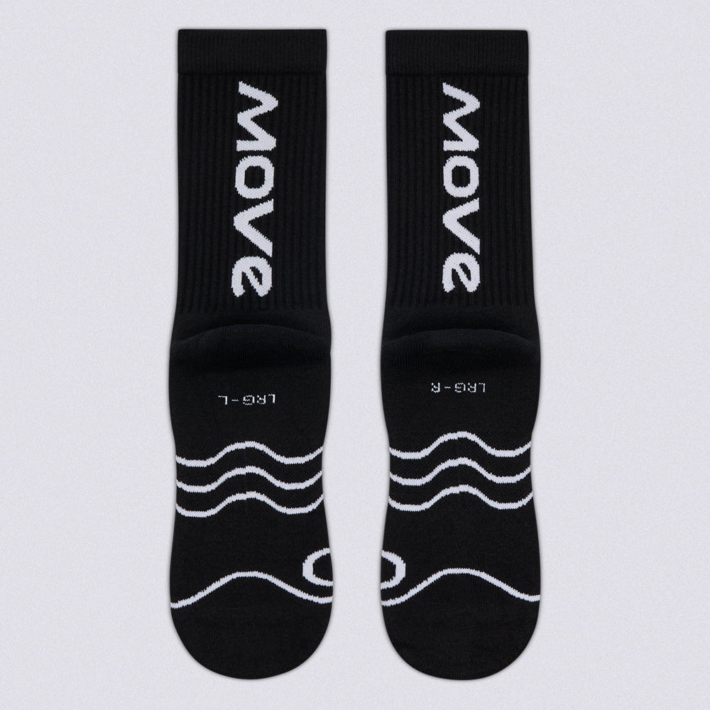 A pair of black crew socks with white printed branding and wave graphics, displayed flat against a light gray background.